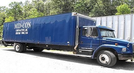 Mid-Con Contractors box truck, painted with the company name